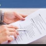 Job seeker writing their resume.