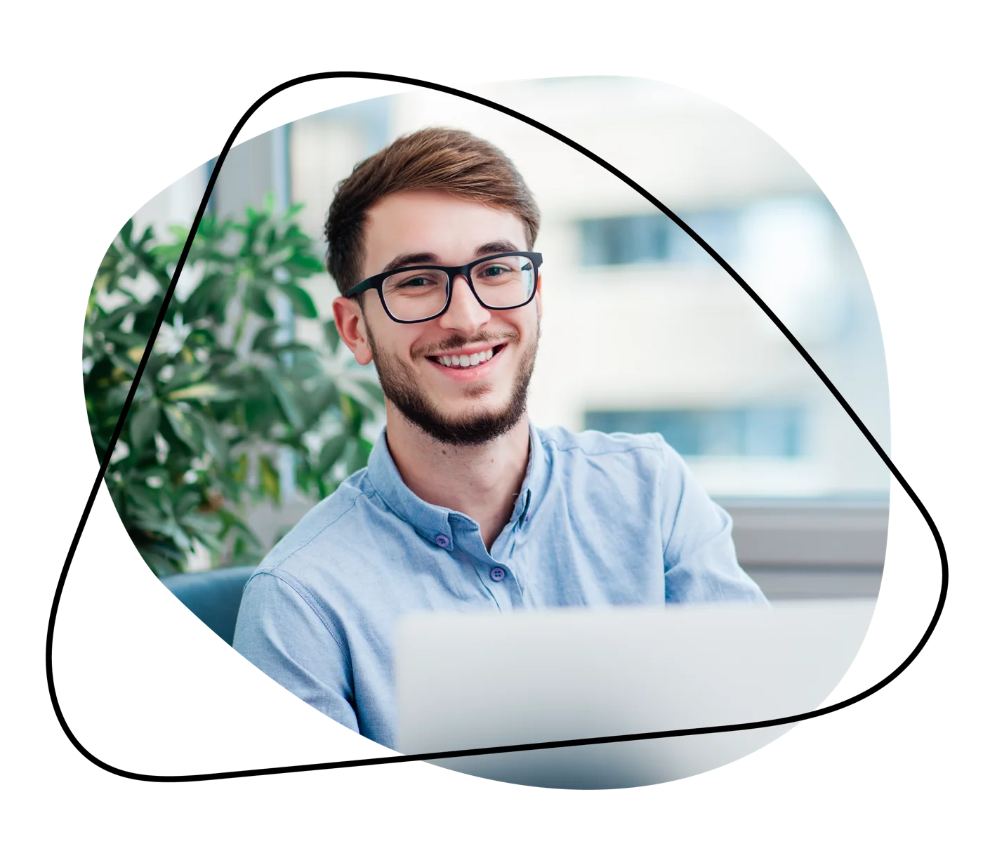 Smiling professional at a desk, representing a successful sales or marketing candidate.