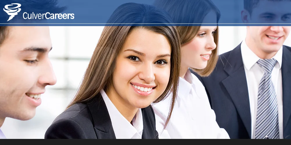 Smiling professionals in a business meeting representing Culver Careers' expertise in sales and marketing recruitment.